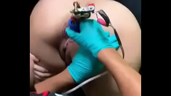 Fresh Tattooing a young lady's anus energy Videos