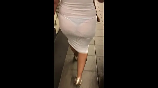 Νέα Wife in see through white dress walking around for everyone to see ενεργειακά βίντεο