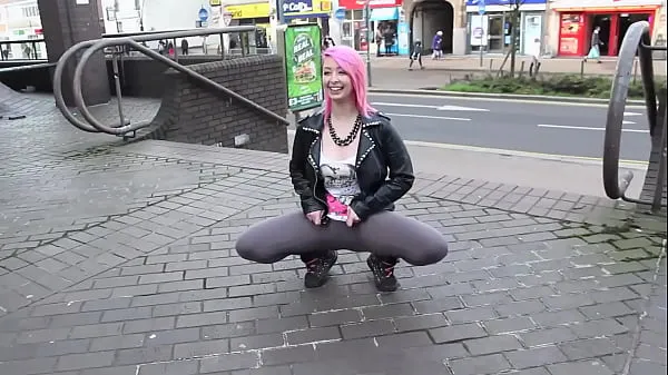 Beautiful and very slutty slut shows her ass in public while pissing between her legs