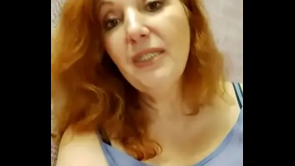 Νέα Redhead lady in a blue blouse ενεργειακά βίντεο